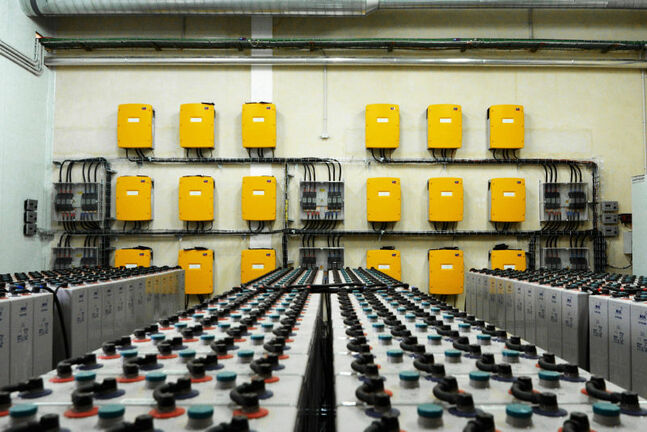 Technical room with Sunny Island battery inverters and batteries